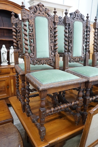 A set of six 19th century Carolean style carved oak dining chairs and one other similar chair (7)